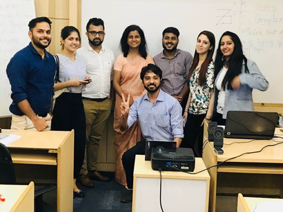 Lucky Daftuar with participants after a training session