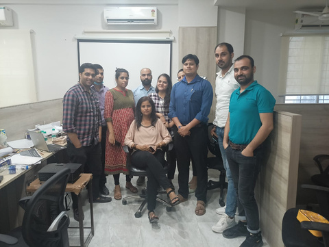 Participants gathered after a workshop in an office