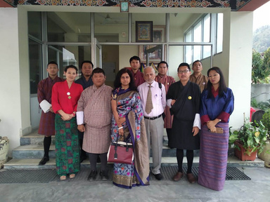 Group photo with participants in formal and traditional wear